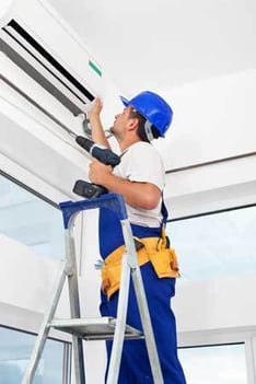 Aircon Installation on a ladder SG World