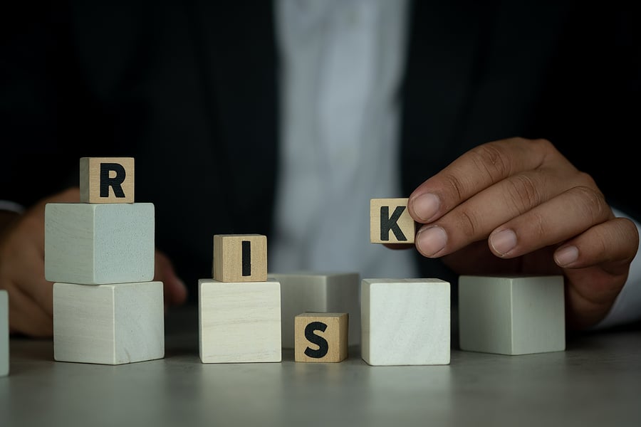 bigstock-Businessman-In-Suit-Holding-Of-416731468