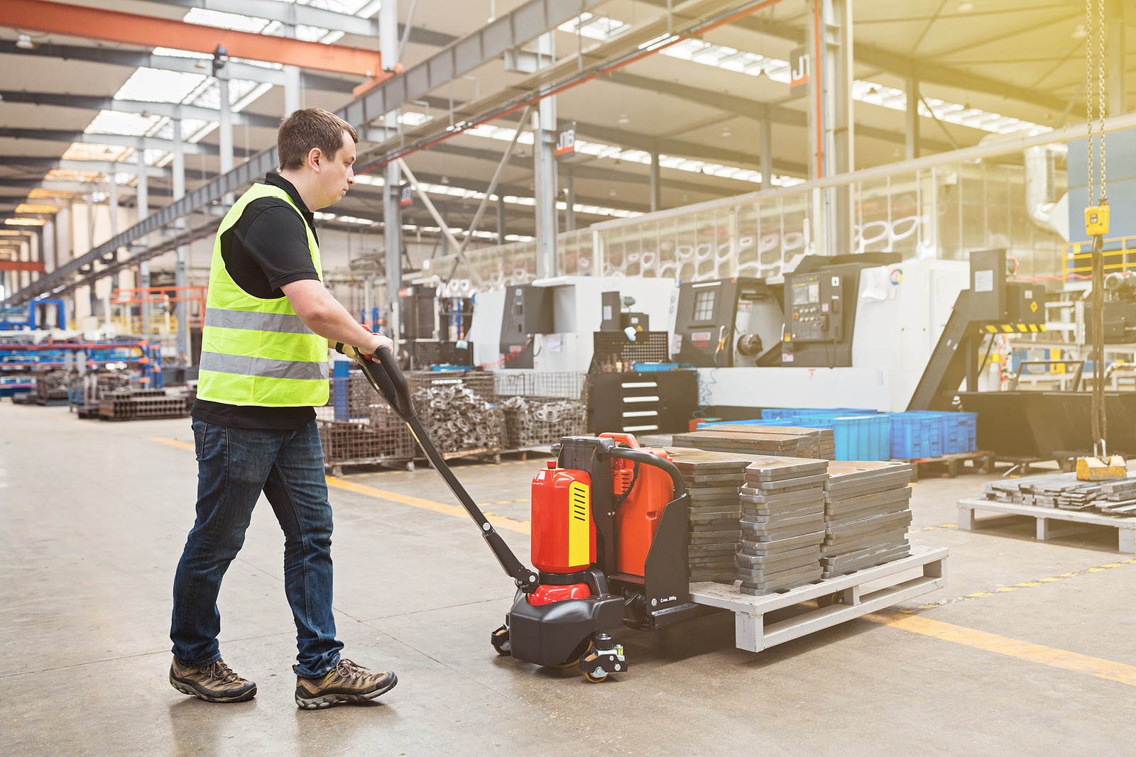 bigstock-Warehouse-Worker-Dragging-Hand-450715321